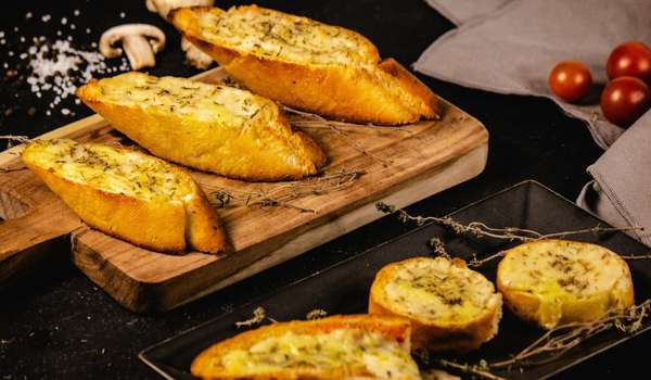 Cut the Garlic Bread in Half Lengthwise