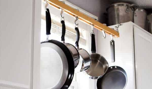 Pans Sideways Stack  How to Organize Kitchen Cabinets in a Small Kitchen